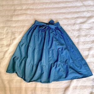 Knee length denim skirt with bow